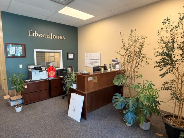 Unit 150 retail for lease — reception area with front desk and plants