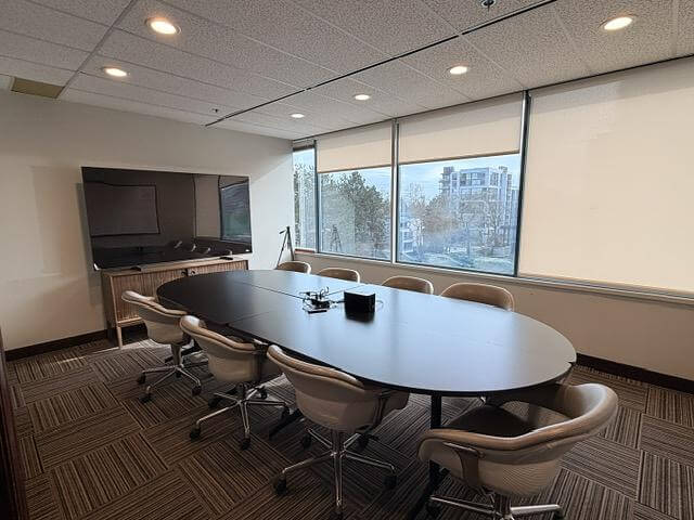 Boardroom with conference table in office Unit 433 at 5811 Cooney Road